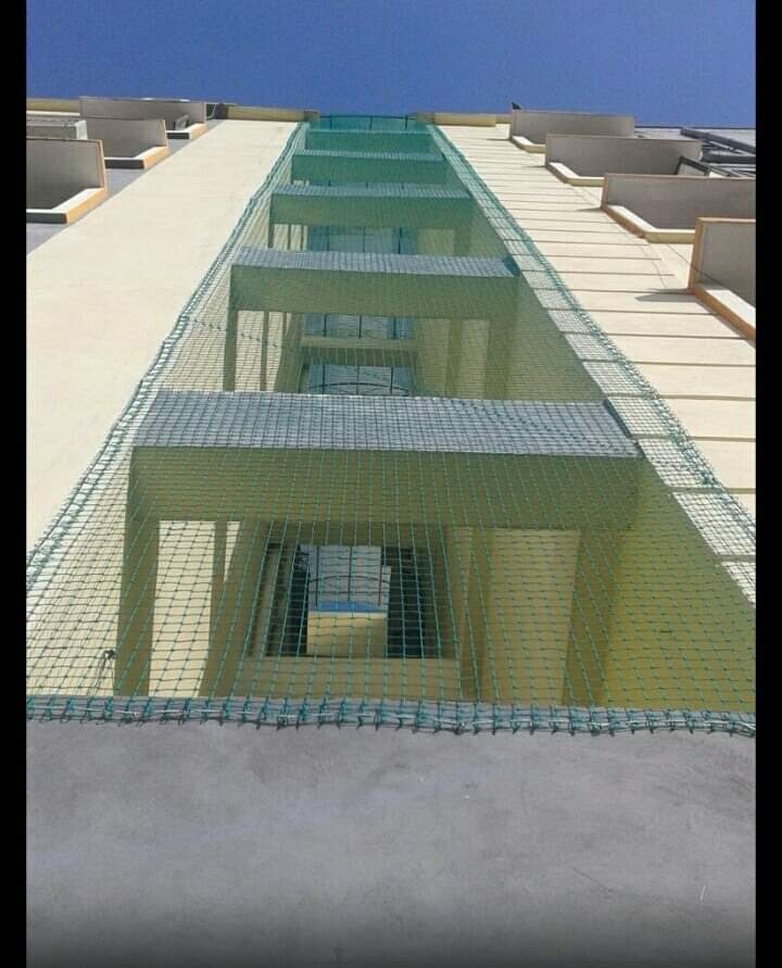 Multi-floor balcony safety net installation on high-rise
