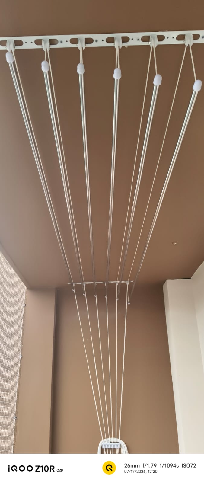 Retractable cloth drying hanger on balcony ceiling